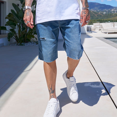 Bee Inspired Garnacho Jean Shorts in Mid Blue, heavyweight denim shorts with rip detailing and a raw hem, back view