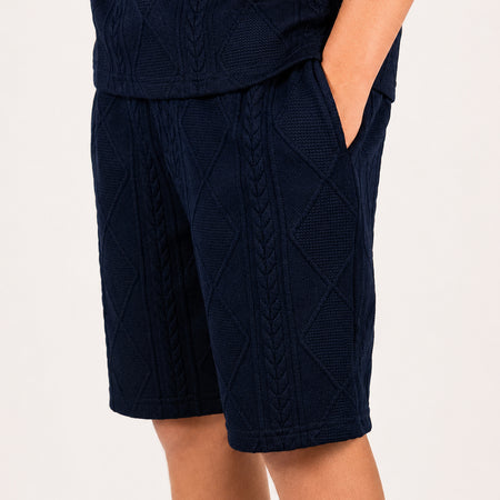 Bee Inspired Junior Konsa Twin Set in Navy, matching polo shirt and shorts twin set in lightweight cotton, close-up crop shot