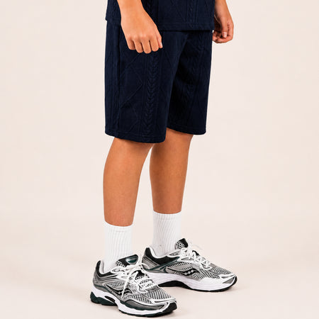 Bee Inspired Junior Konsa Twin Set in Navy, matching polo shirt and shorts twin set in lightweight cotton, close-up crop shot
