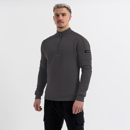 Bee Inspired Klose 1/4 Zip in Charcoal, slim fit quarter-zip with stretch cuffs and sleeve panelling, styled shot