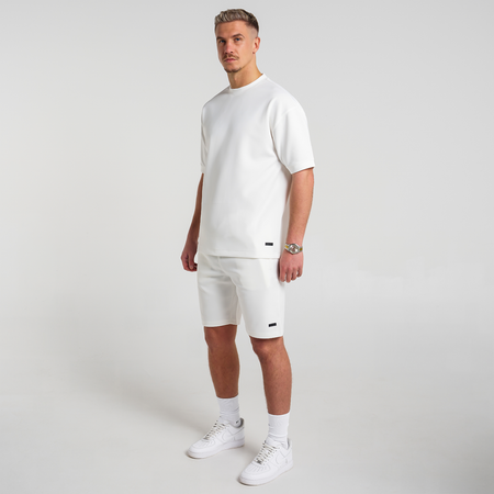 Bee Inspired Morata Short in Ivory, relaxed fit shorts in neoprene fabric with a branded hem print, styled shot