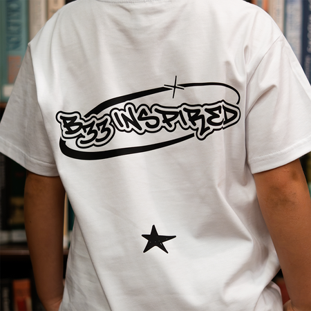 Junior Senesi T-Shirt in white and black, focusing on a small chest graphic