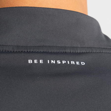 Bee Inspired Signature Sports 1/4 Zip in Charcoal, quarter-zip sports top with a thumb hole in the sleeve, styled shot