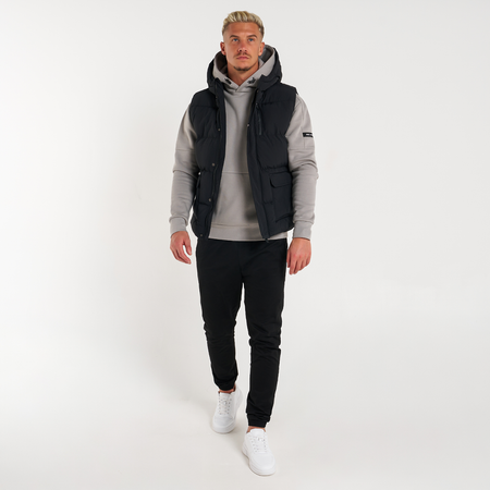Bee Inspired Aaronson Gilet in Black, heavyweight hooded gilet with a chest pocket and multiple utility pockets, styled shot