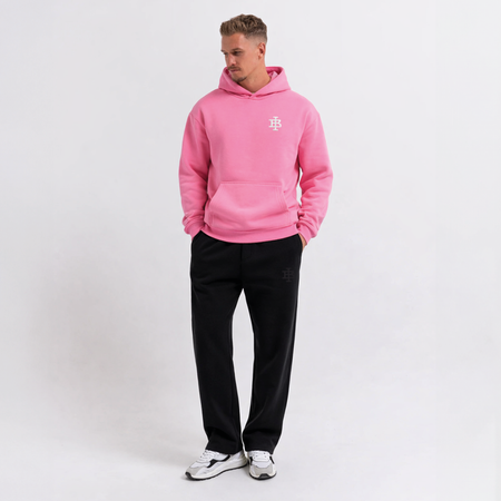 Bee Inspired Guedes Hoodie in Bubblegum Pink, hoodie with a clean embroidered BI monogram graphic, close-up crop shot