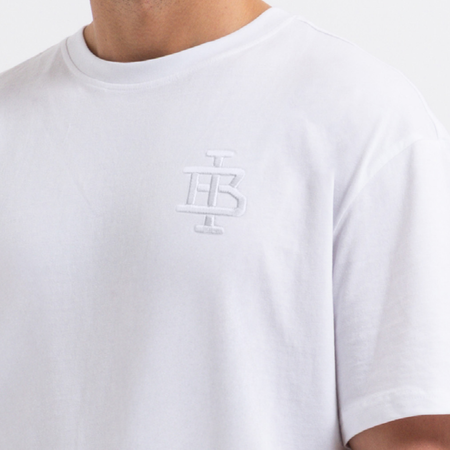 Bee Inspired Guedes T-Shirt in White/White, tee with a clean embroidered BI monogram graphic, close-up crop shot