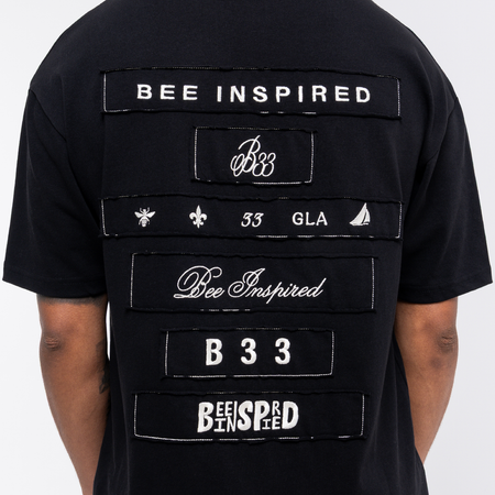 Legacy Logo T-Shirt in black showing the relaxed fit