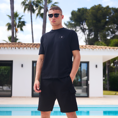 Legacy Logo T-Shirt in black, focusing on the signature Bee logo