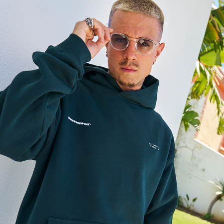 Bee Inspired Mata Hoodie in Pine Green, oversized hoodie with a bold rear graphic print, back view
