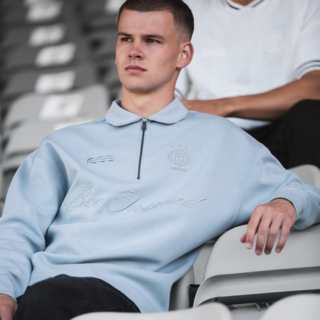 Bee Inspired Zico Zip Polo in Blue, long sleeve collared polo with a quarter-zip neckline, styled lifestyle shot