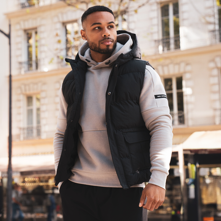Bee Inspired Aaronson Gilet in Black, heavyweight hooded gilet with a chest pocket and multiple utility pockets
