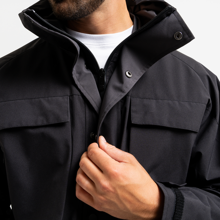 Bee Inspired Pellegrini Jacket in Black, multi-pocket jacket with a hood that packs away, back view