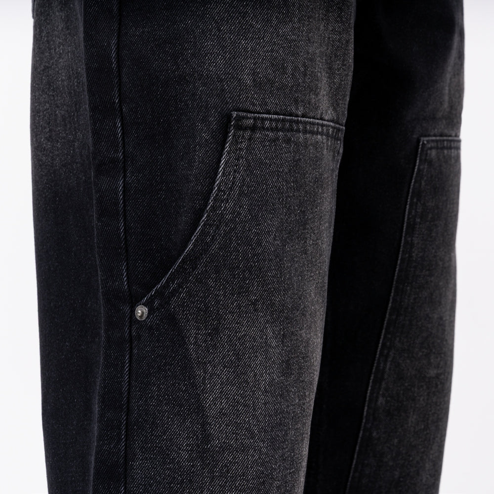 Pirlo Relaxed Jeans in black, focusing on branded rivets