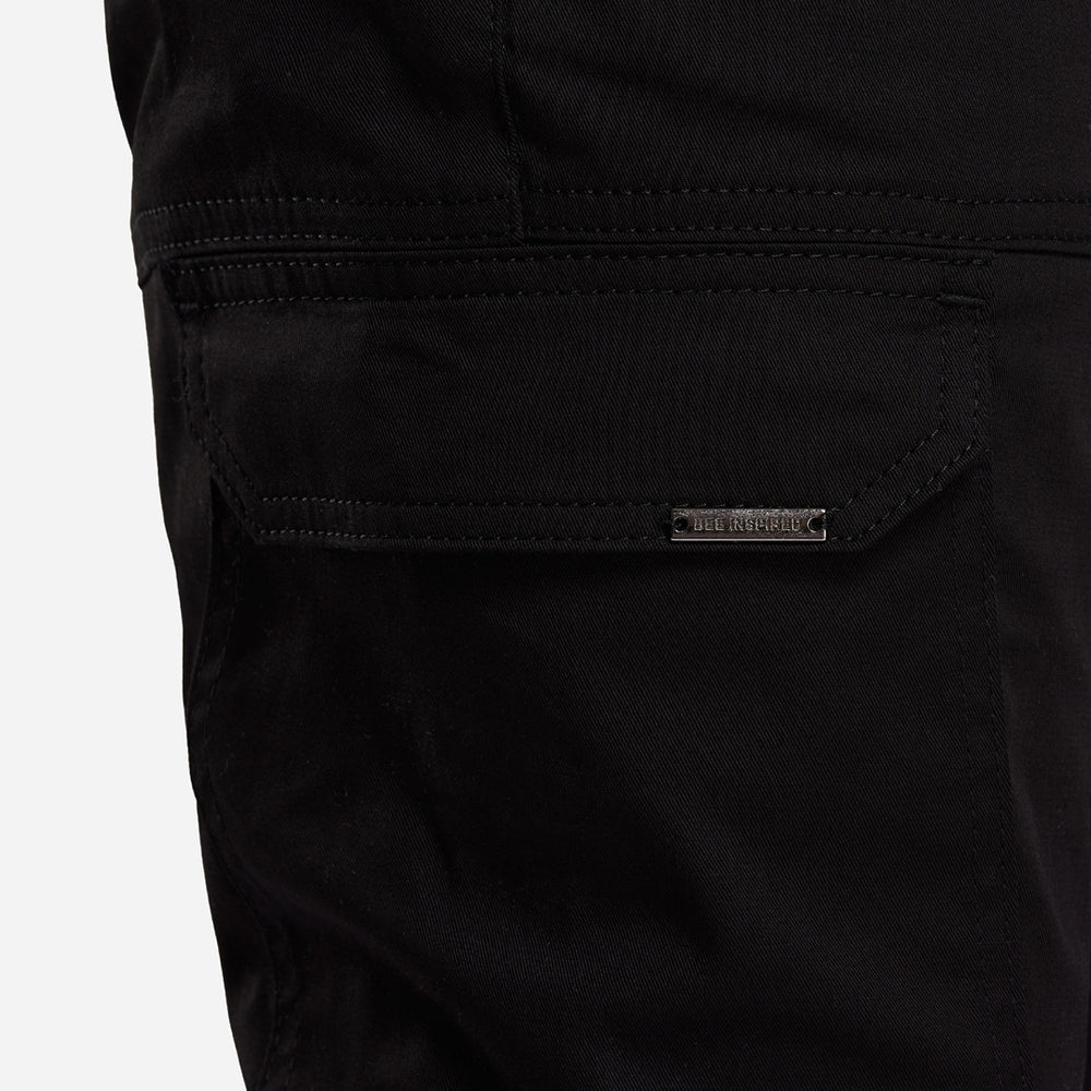 Close up of multiple utility pockets on the Rivero Cargo Pants in black