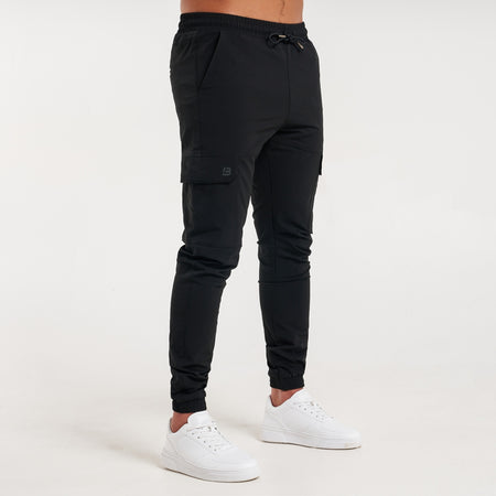 Rivero Tech Cargo Pants in black with a metal branded pocket label
