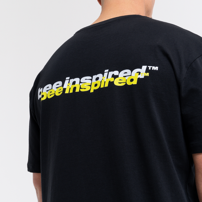 Black t-shirt with 'bee inspired' text on the back against a plain background