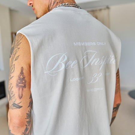 Bee Inspired Team Vest in Faded Bone, heavyweight cotton vest with raw armhole detailing, close-up