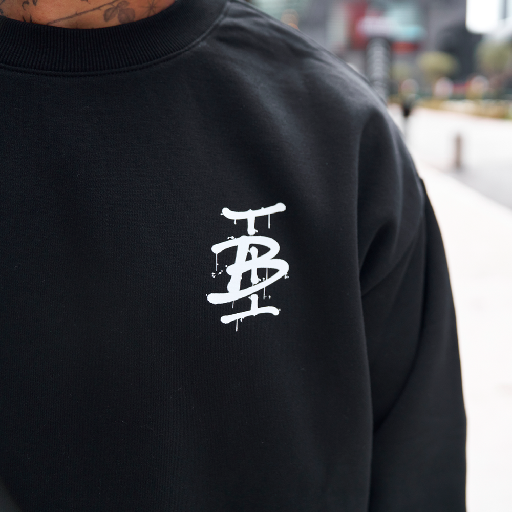 Bee Inspired Tonali Crew in Black/Red, close-up of graffiti-style chest graphic detail