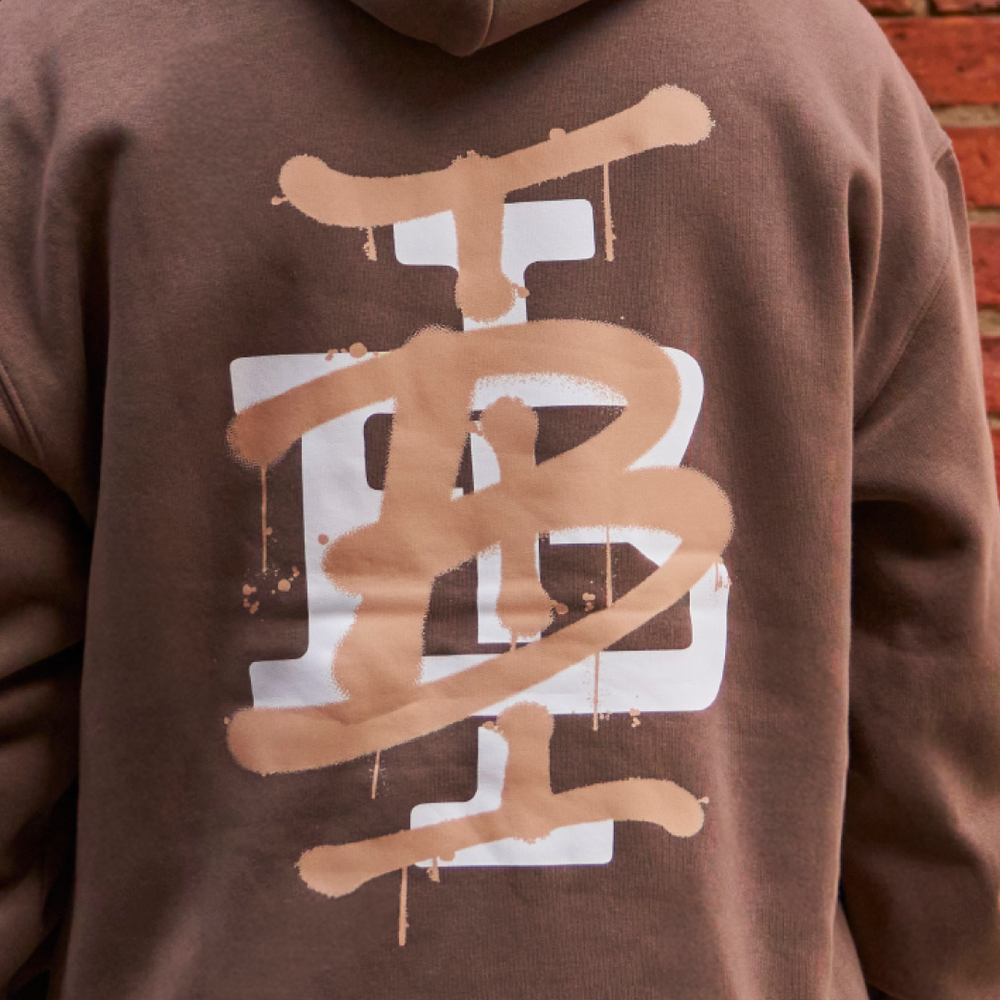 Bee Inspired Tonali Hoodie in Walnut, close-up of large graffiti-style back graphic detail