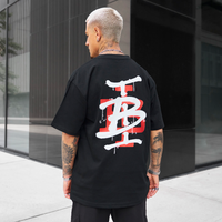 Bee Inspired Tonali Oversized T-Shirt in Black/Red, oversized tee with a graffiti-style BI monogram print, front view