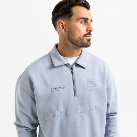 Bee Inspired Zico Zip Polo in Blue, long sleeve collared polo with a quarter-zip neckline, front view
