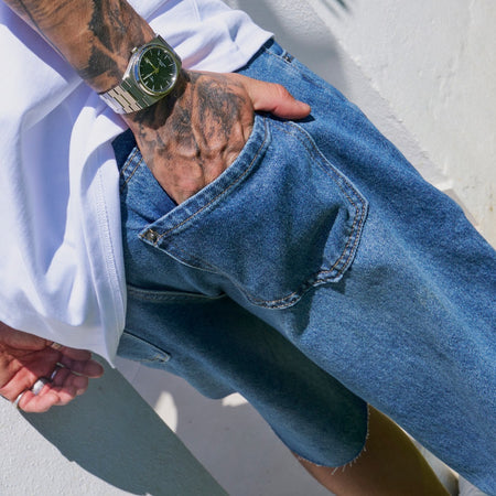 Bee Inspired Garnacho Jean Shorts in Mid Blue, heavyweight denim shorts with rip detailing and a raw hem, close-up