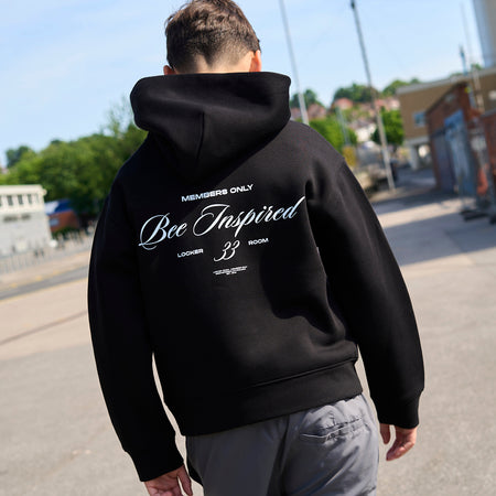 Bee Inspired Junior Team Hoodie in Black, heavyweight cotton junior hoodie with dropped shoulders, styled lifestyle shot