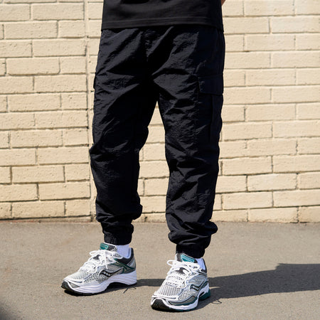 Bee Inspired Junior Madueke Cargo Pants in Black, regular fit junior cargo trousers with utility pockets and stretch cuffs