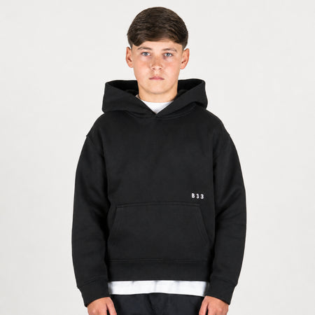 Bee Inspired Junior Initial Hoodie in Black, relaxed fit junior hoodie, close-up crop shot