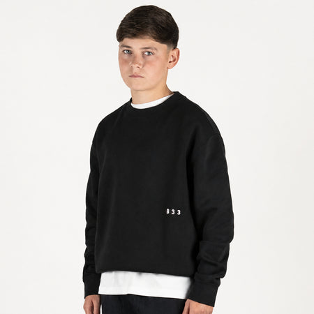 Bee Inspired Junior Initial Crew in Black, relaxed fit junior crew sweatshirt, close-up crop shot