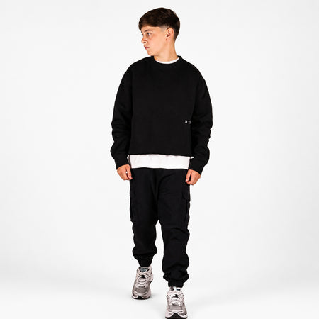 Bee Inspired Junior Madueke Cargo Pants in Black, regular fit junior cargo trousers with utility pockets and stretch cuffs