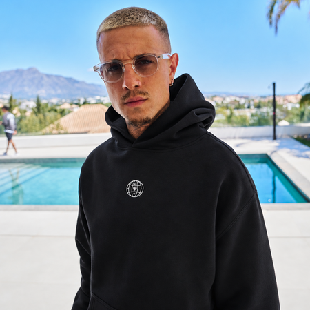 Bee Inspired Sagna Hoodie in Black, relaxed fit hoodie with a bold back graphic, styled shot