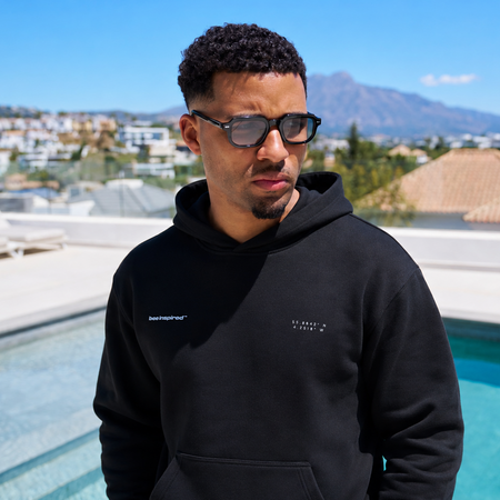 Bee Inspired Mata Hoodie in Black, oversized hoodie with a bold rear graphic print, styled shot