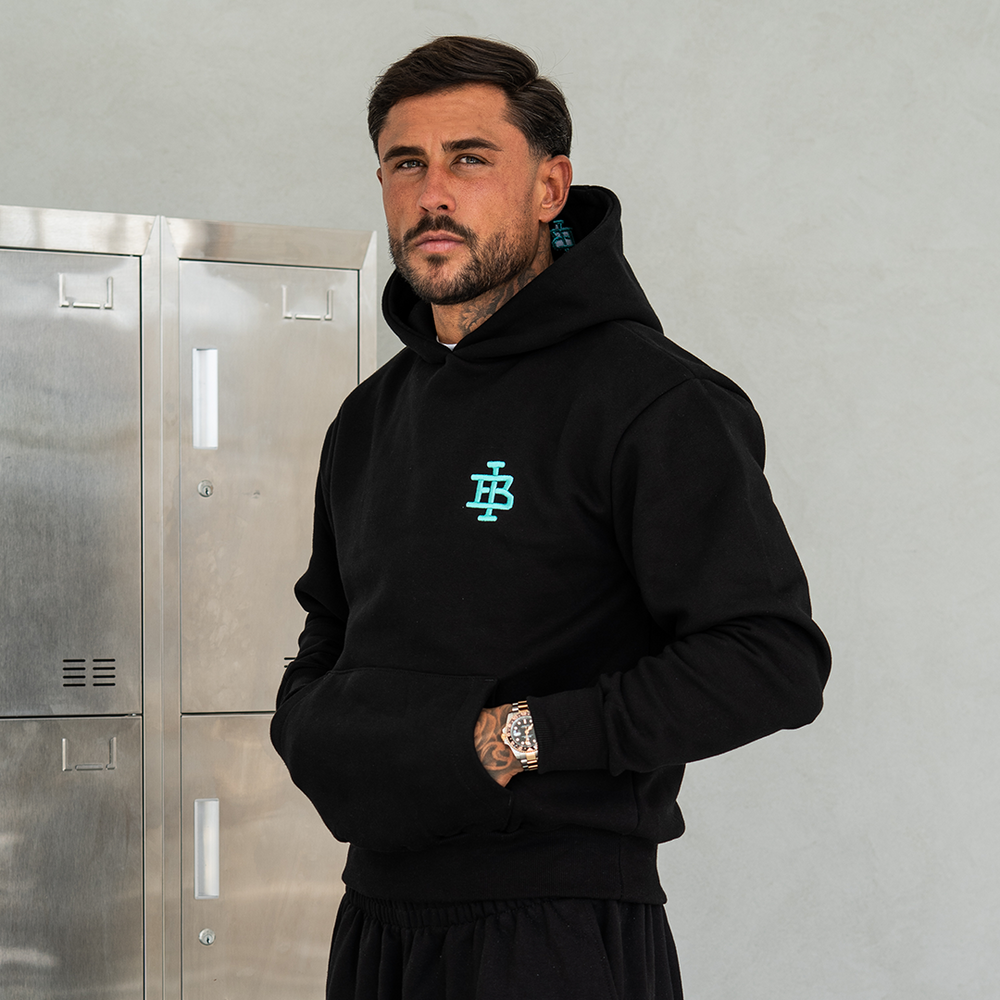 Bee Inspired Guedes Hoodie in Black/Aqua, styled shot