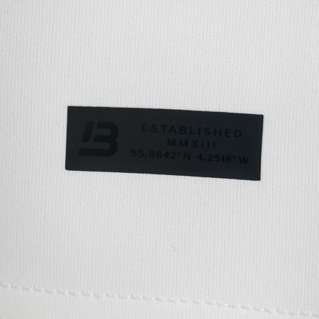 Bee Inspired Morata Short in Ivory, relaxed fit shorts in neoprene fabric with a branded hem print, front view