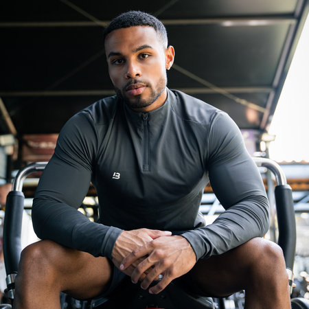 Bee Inspired Signature Sports 1/4 Zip in Charcoal, quarter-zip sports top with a thumb hole in the sleeve