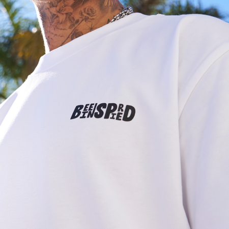 Bee Inspired Aguirre Oversized T-Shirt in White/Red, oversized fit tee with a raised print across chest and back, close-up
