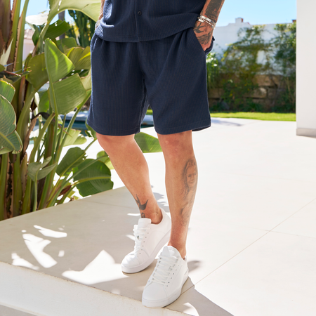 Bee Inspired Ake Short in Dark Navy, relaxed fit shorts with subtle branding, front view