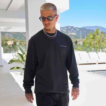 Bee Inspired Alonso Long Sleeve Top in Faded Black, relaxed fit long sleeve graphic tee with a faded wash, close-up