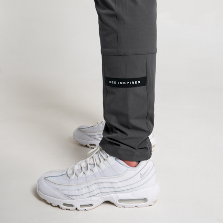Bee Inspired Milito Pants in Charcoal, slim fit cargo trousers in stretch ripstop fabric, close-up crop shot