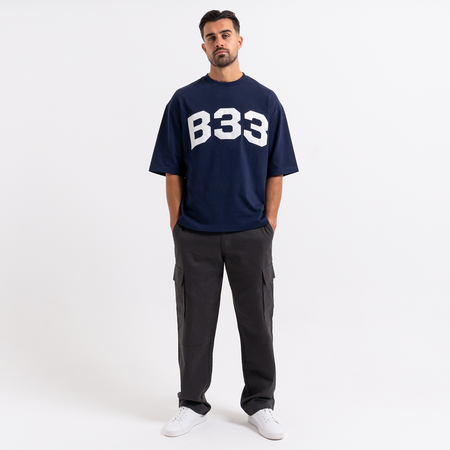 Bee Inspired Figo T-Shirt in Navy, heavyweight cotton tee with a large twill fabric appliqu\u00e9, close-up