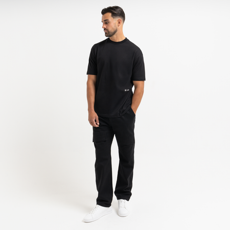 Bee Inspired Foden Cargo Pant in Black, cotton twill cargo trousers with front pockets and back branding, styled shot