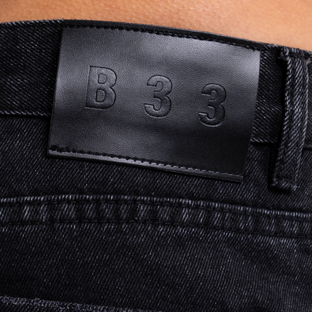 Bee Inspired Garnacho Jean Shorts in Washed Black, heavyweight denim shorts with rip detailing and a raw hem, back view