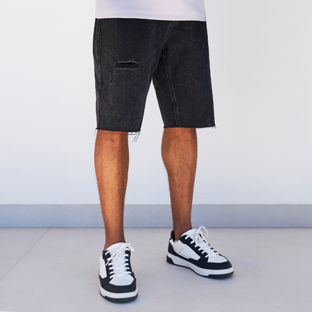 Bee Inspired Garnacho Jean Shorts in Washed Black, heavyweight denim shorts with rip detailing and a raw hem, front view