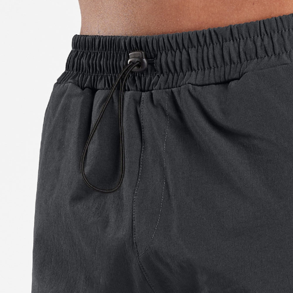 Close up of multiple utility pockets on the Guardiola Cargo Pants in charcoal