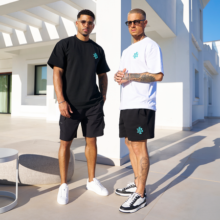 Bee Inspired Guedes Cotton Short in Black/Aqua, brushback fleece shorts built for comfort and movement, close-up crop shot