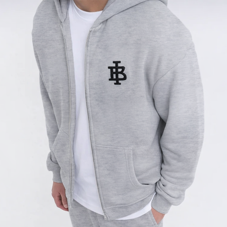 Bee Inspired Guedes Zip Hoodie in Grey Marl, zip hoodie with a clean embroidered BI monogram graphic, close-up crop shot