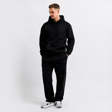 Bee Inspired Guedes Jogpant in Black, jogpants with a clean embroidered BI monogram, close-up crop shot