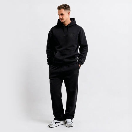 Bee Inspired Guedes Hoodie in Black, hoodie with a clean embroidered BI monogram graphic, close-up crop shot