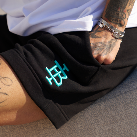 Bee Inspired Guedes Cotton Short in Black/Aqua, brushback fleece shorts built for comfort and movement, close-up crop shot